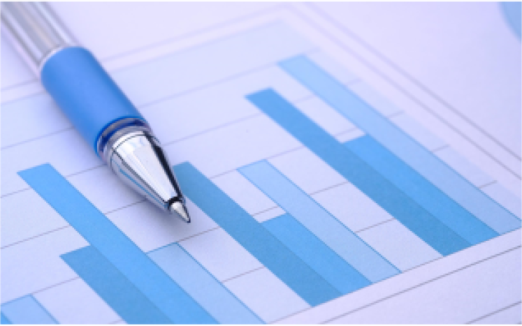 paper with blue bar graphs and pen
